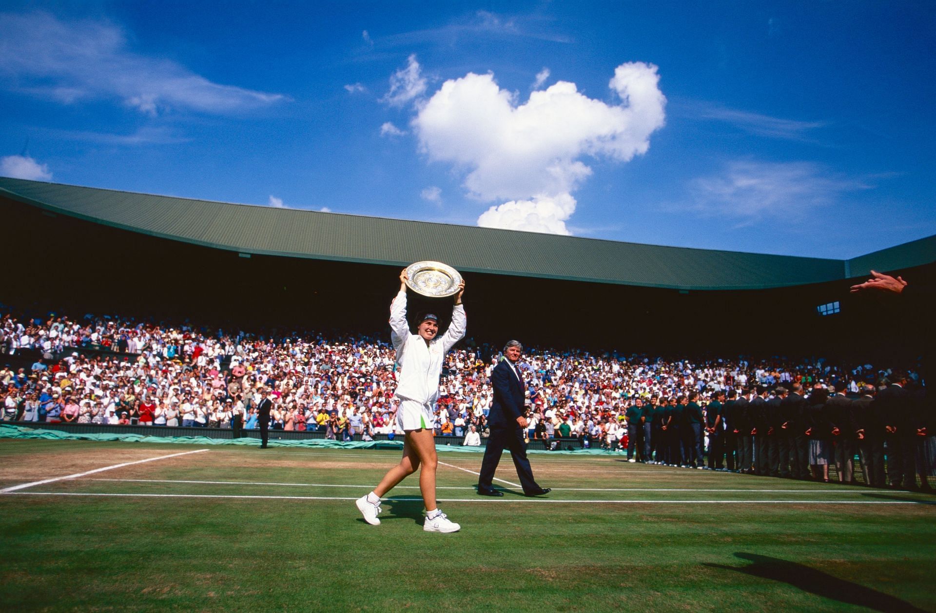 Martina Hingis with the 1997 Wimbledon trophy. (Source: Getty)